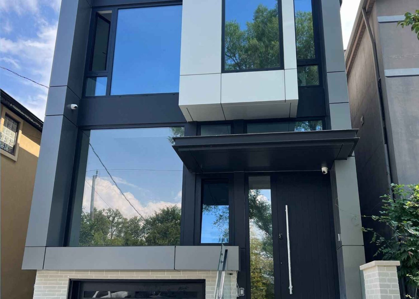 Front elevation with Metallic Grey ALUBOND ACM frames tying upper level on Melrose Ave North York