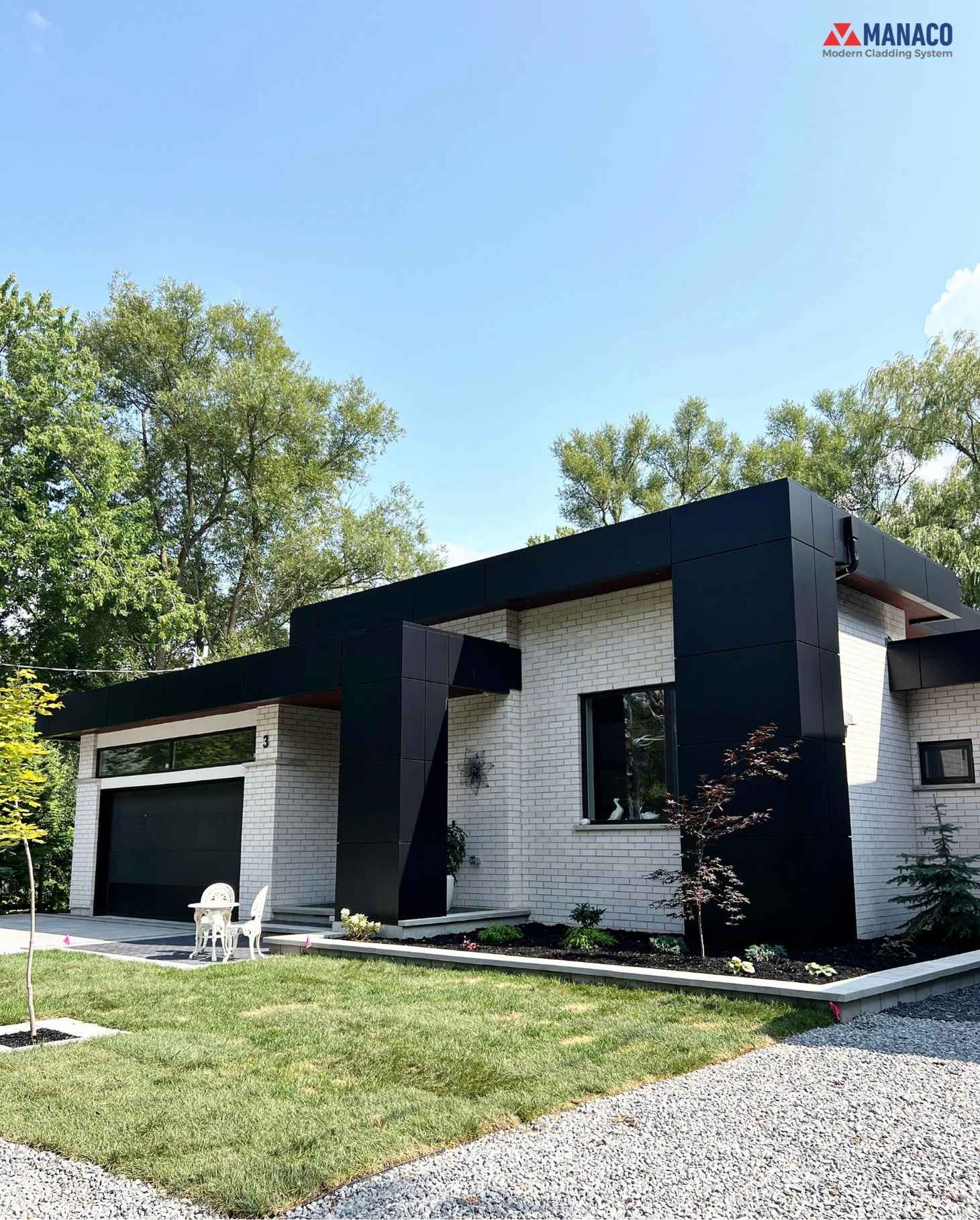 Porch steps under a Jet Black ACM canopy with warm Dark Winchester soffits